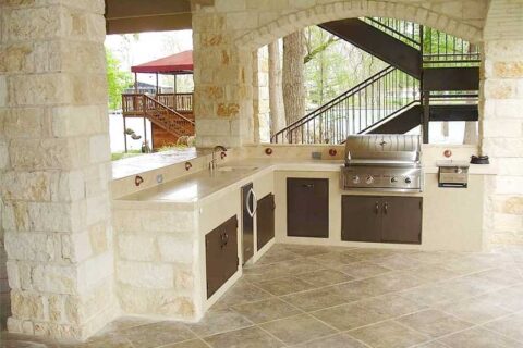 Spacious Outdoor Kitchen with Modern Appliances by ED Aluminum Construction